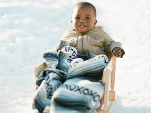 A baby in a sled