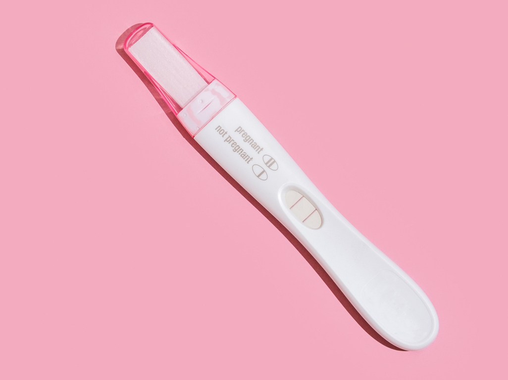 Pregnancy test in a pink background